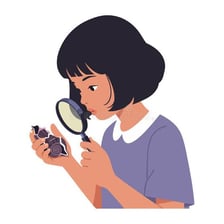 A person using a magnifying glass to inspect a very small detail.