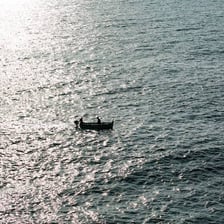 A small boat surrounded by open water.