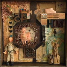 A shadow box display case beside a shoebox.