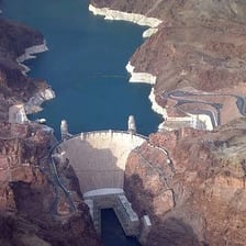 A dam holding back water in a reservoir