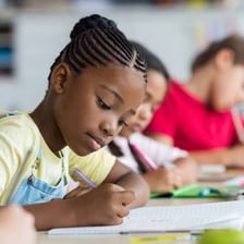 A student works through questions on a test.