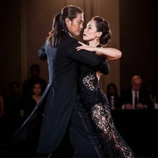 A couple performing a dramatic ballroom tango