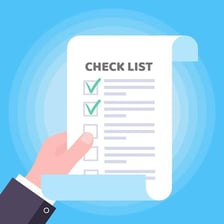 A hand marking a checkbox on a printed form.