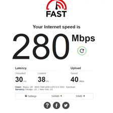 A Wi-Fi speed test displaying download and upload rates.