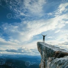 A person standing near the edge of a cliff