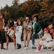 A person wearing a costume to represent someone else