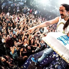 Steve Aoki performing as a disc jockey