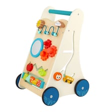 A toddler using a toy walker that is pushed along the floor.