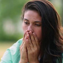 A person looking regretful after making a decision.