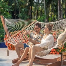 A person relaxing in a hammock