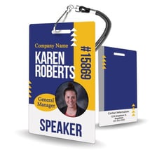 A conference attendee wearing an identification badge.