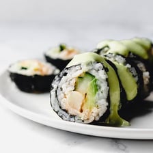 Green wasabi paste served beside sushi