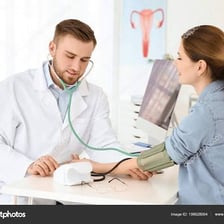 A doctor speaking with a patient in a gynecology clinic.