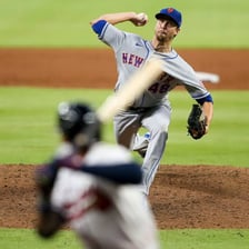 A baseball pitcher throwing from the mound