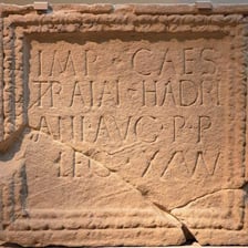 The Roman numeral I displayed in an ancient-style inscription
