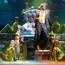 Various objects arranged as props on a theater stage.