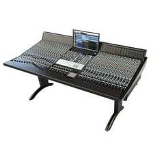 A recording studio containing a mixing console and microphones.