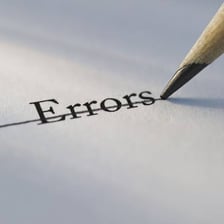 Paperwork showing a mistake marked and corrected.