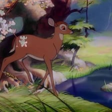 Bambi, the young deer from the 1942 animated film, stands in a forest.