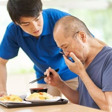A person eating food at a meal