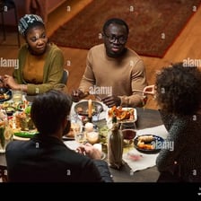 People sharing a meal at a home.