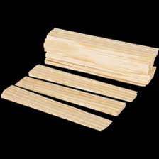 A thin wooden shim inserted between two pieces of wood