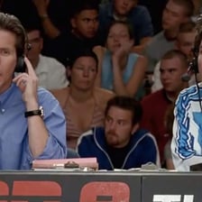 A sports announcer describing a game live from a broadcast booth.
