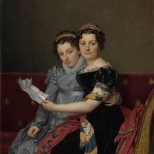 Two sisters posing together in a family portrait