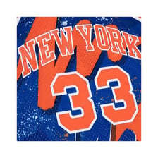Patrick Ewing wearing a New York Knicks jersey with number 33.