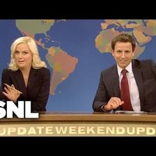 Seth Meyers and Amy Poehler presenting Weekend Update on Saturday Night Live