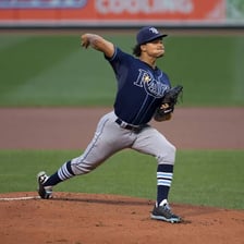 A baseball pitcher throwing a ball.