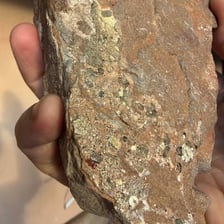 Rock containing a visible vein of metallic ore.