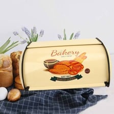 A breadbox sitting on a kitchen counter.