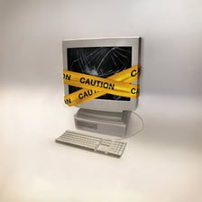 A computer displaying a virus warning and an error screen.