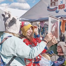 Two people exchanging goods in a fair trade.