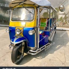 A colorful tuk-tuk motorized rickshaw in Thailand.