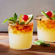 A mai tai cocktail served in a tropical-style glass