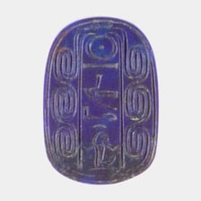 An ancient Egyptian scarab amulet with beetle-shaped decoration