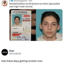 A young adult displaying identification to establish legal age.