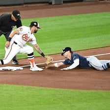 Tampa Bay Rays players on a baseball field.