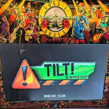 A pinball machine displaying a tilt warning