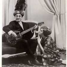 A musician’s electric sitar with its long neck and resonating body