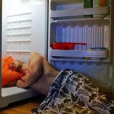 A person sweating in an overheated room