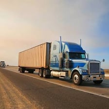 A semitrailer truck traveling on a highway