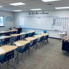 A group of students in a middle school classroom