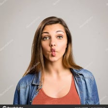 A person making a pronounced grumpy pout.