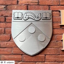 The University of Pennsylvania coat of arms featuring dolphins