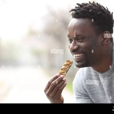 A person eating a small snack.