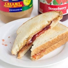 A peanut butter and jelly sandwich cut in half