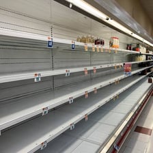 Store shelves with only a small amount of product remaining